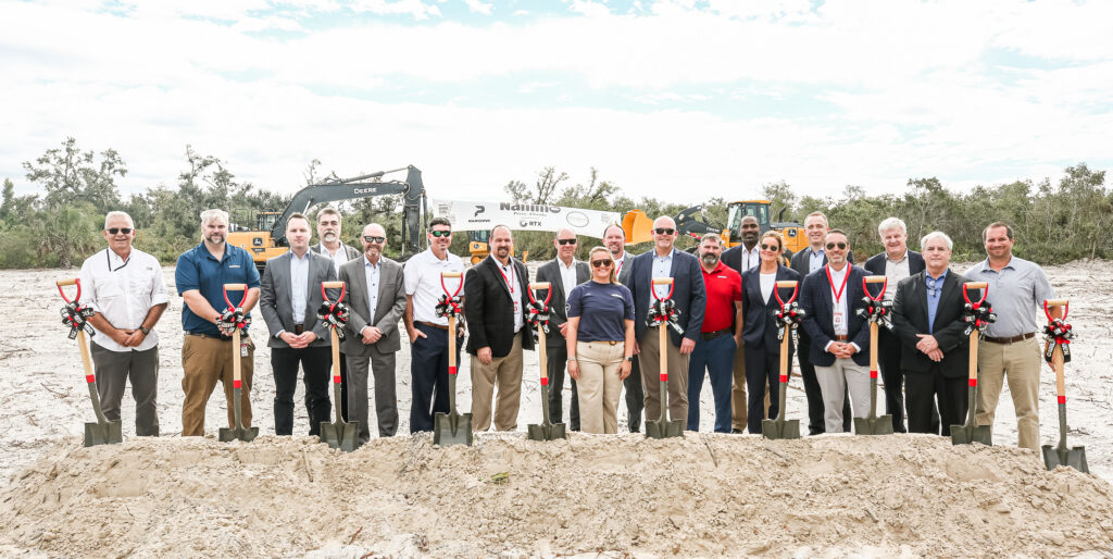 team photo with shovels at groundbreaking site