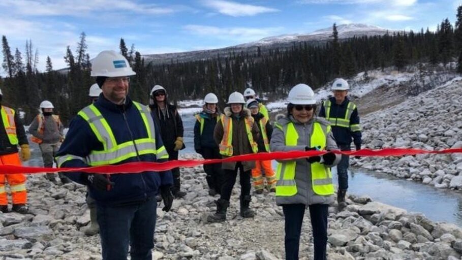 Our team celebrates at a ribbon-cutting ceremony for the opening of the new North Fork Rose Creek diversion at the Faro Mine site.