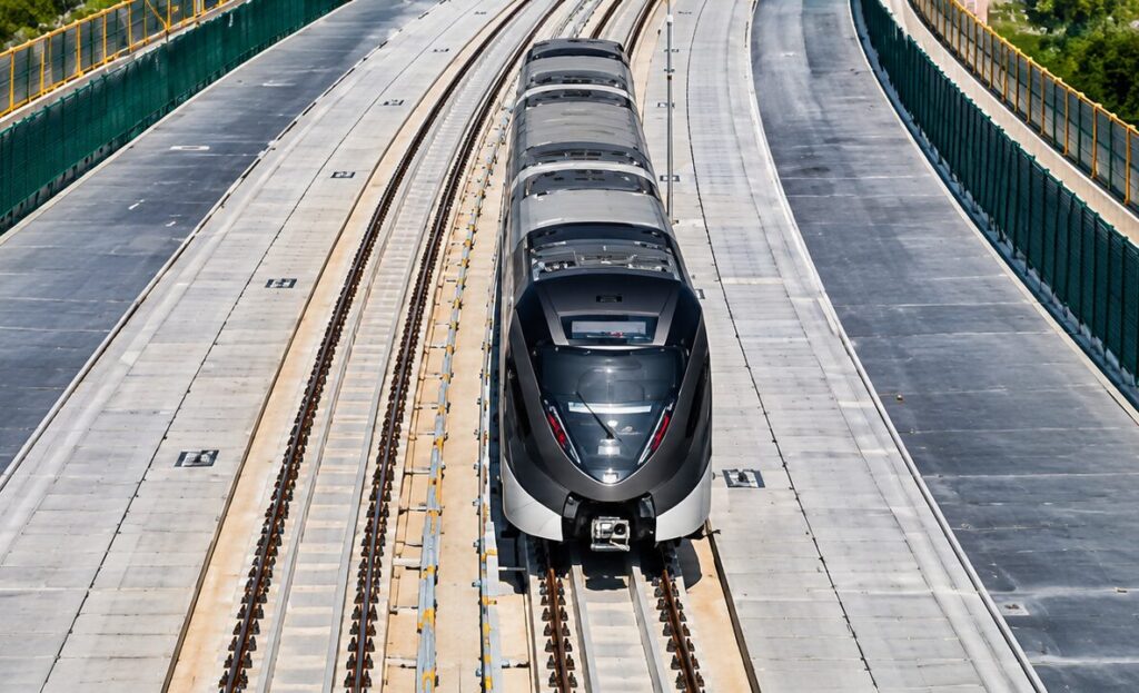 One of 110 driverless Doha Metro trains, supported by Parsons, operating on an elevated track.